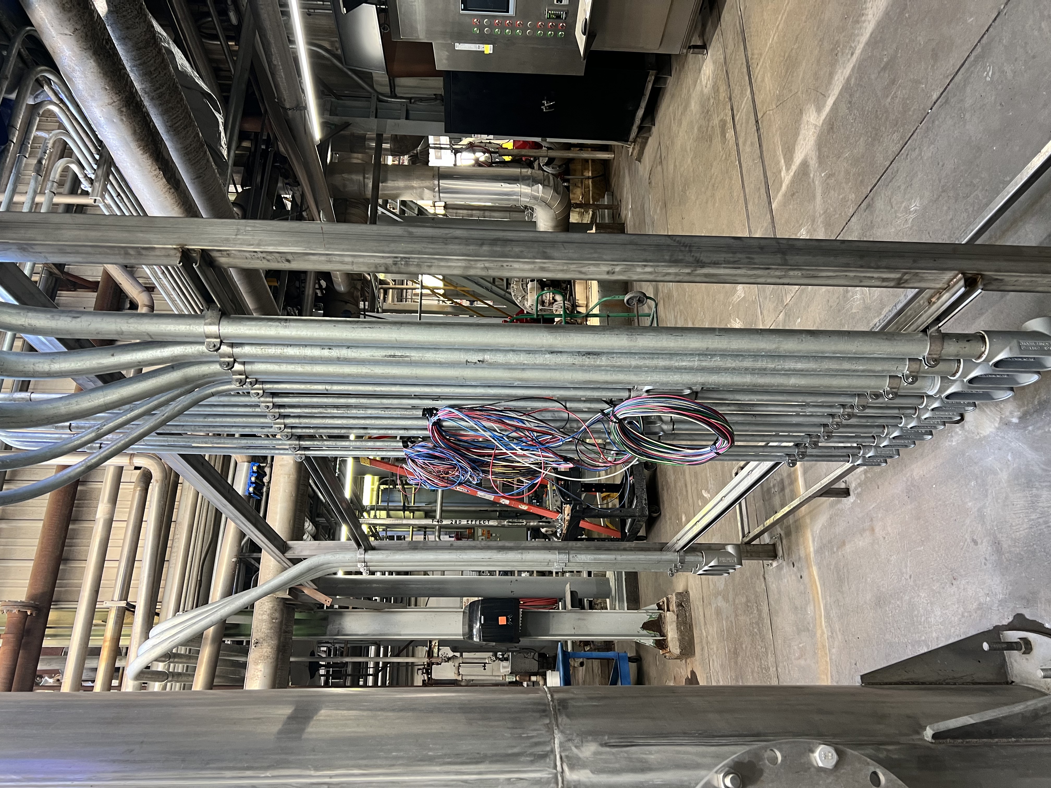 Rigid conduits routed to PLC controls panel